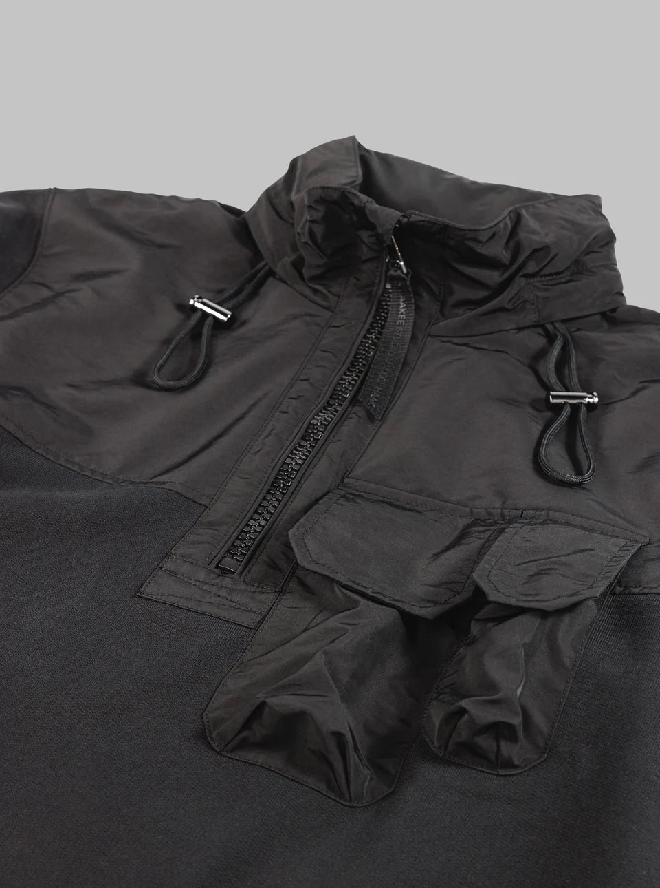 HALF ZIP HYBRID SWEATER